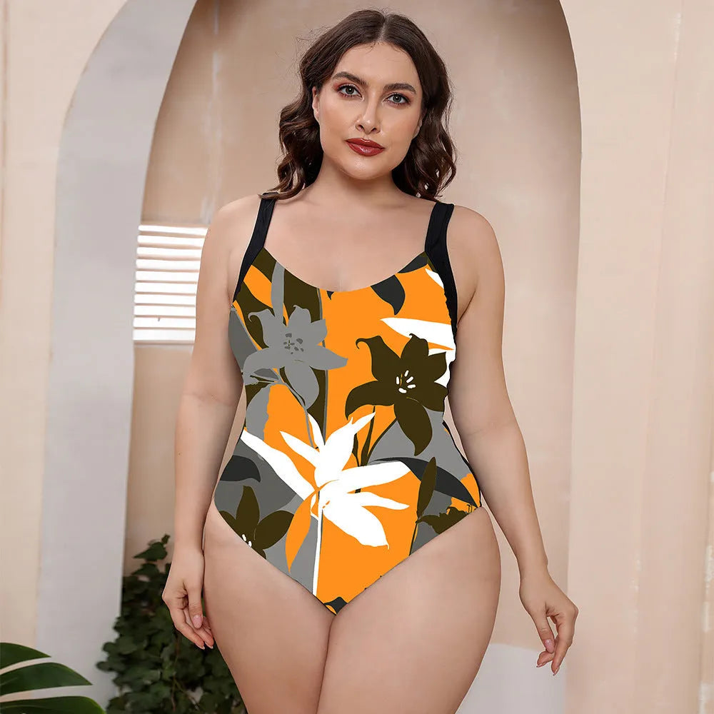 Women's vest style one-piece floral print swimsuit with spaghetti straps on a mannequin.