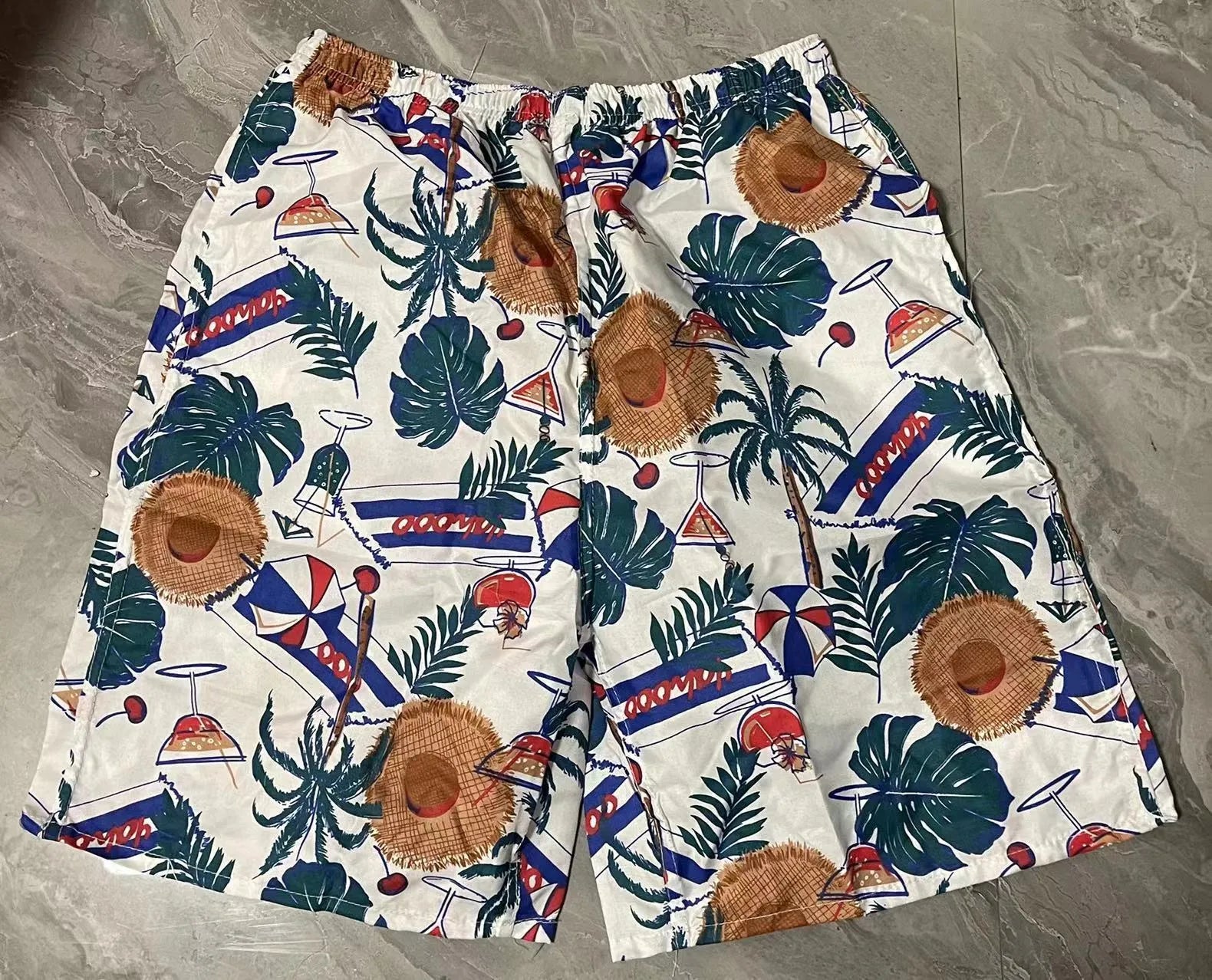 Men's floral printed five-point swimming trunks in free size made of polyester