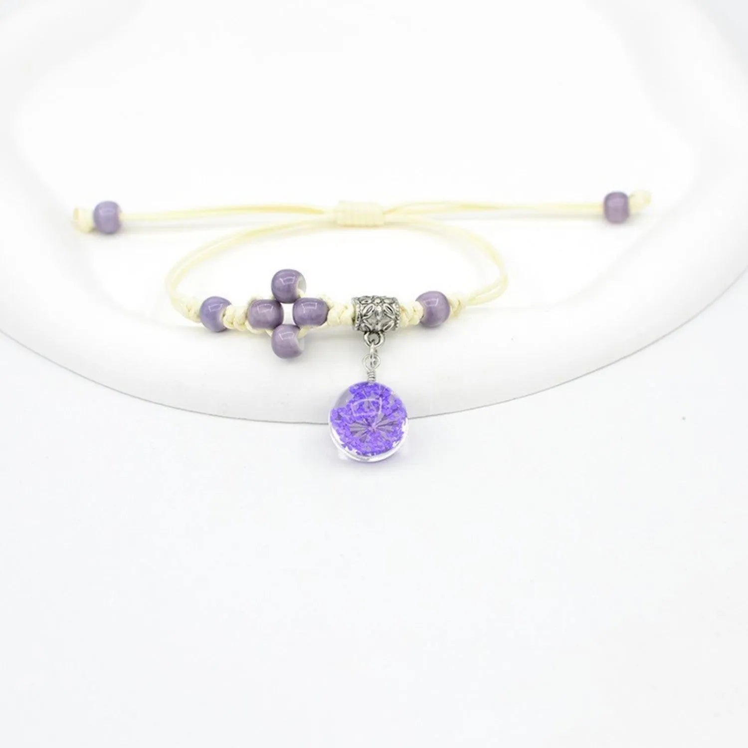 Glass dried flower bracelet with large 1.4 cm beads containing real preserved flowers in hand-woven lace design