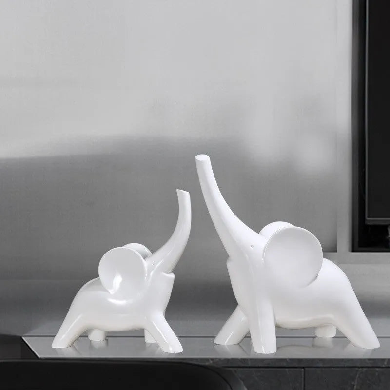 Modern resin elephant ornament in rose gold or white finish, available in large and small sizes