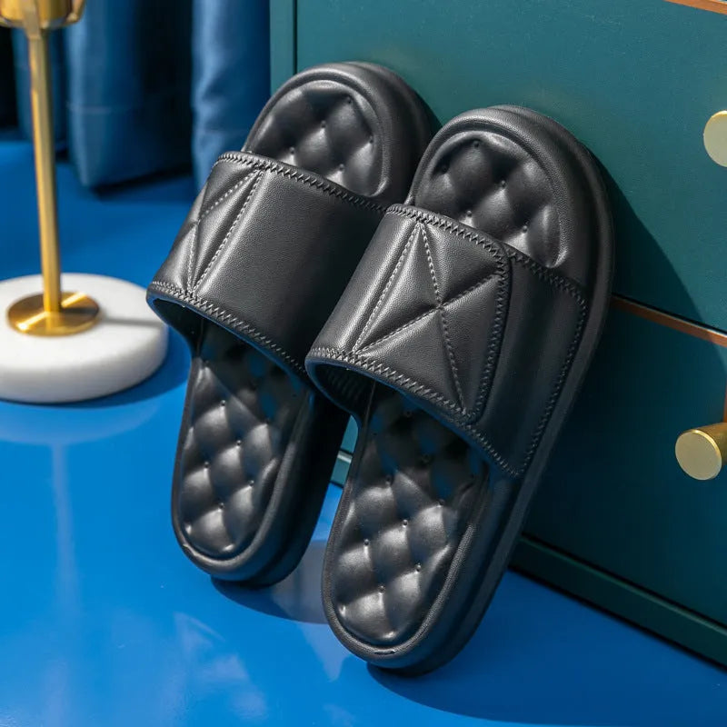 A pair of thick-soled EVA bathroom slippers in a selected colour, showing the non-slip sole pattern.