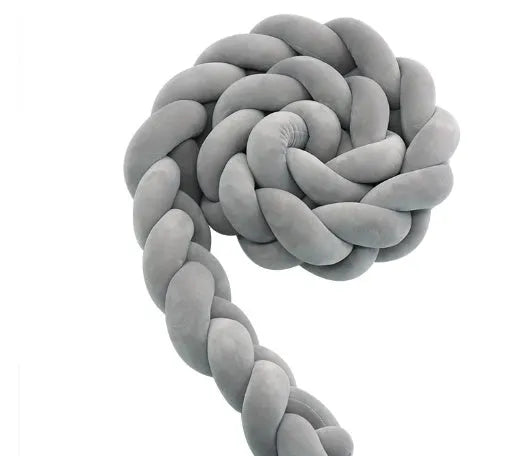 Braided spandex velvet baby bumper shown in a light grey colour, flexed to show its bendable design.