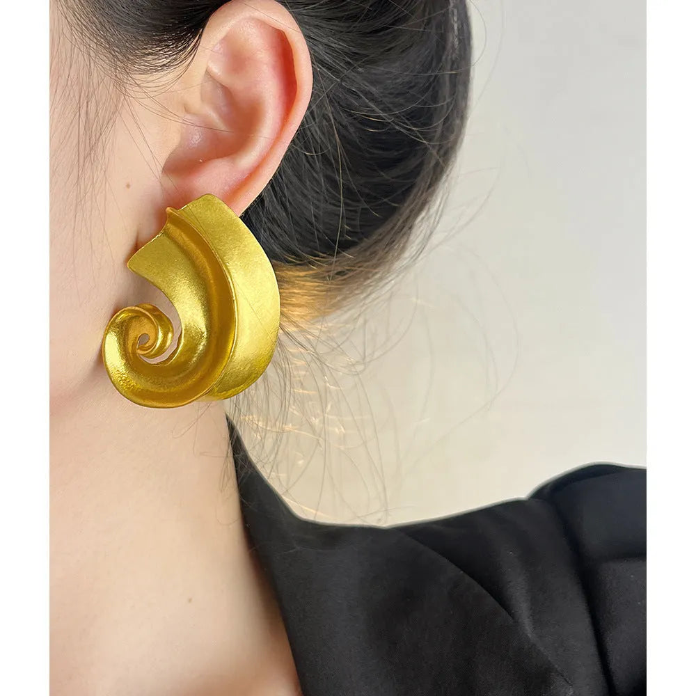 Geometric retro design alloy ear studs in gold or silver colour, 5cm size.