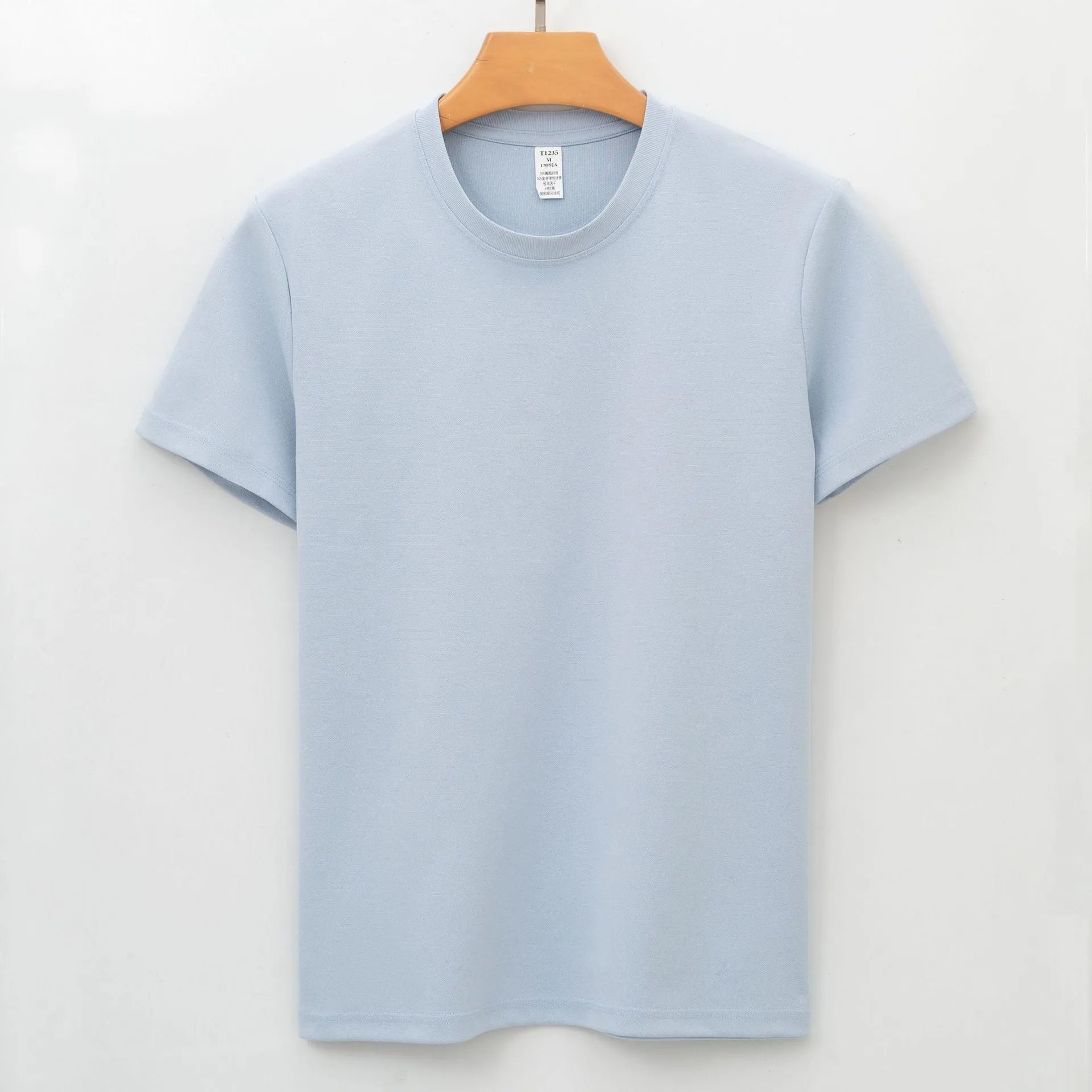Men's solid colour quick-dry antibacterial short sleeve t-shirt on a hanger.