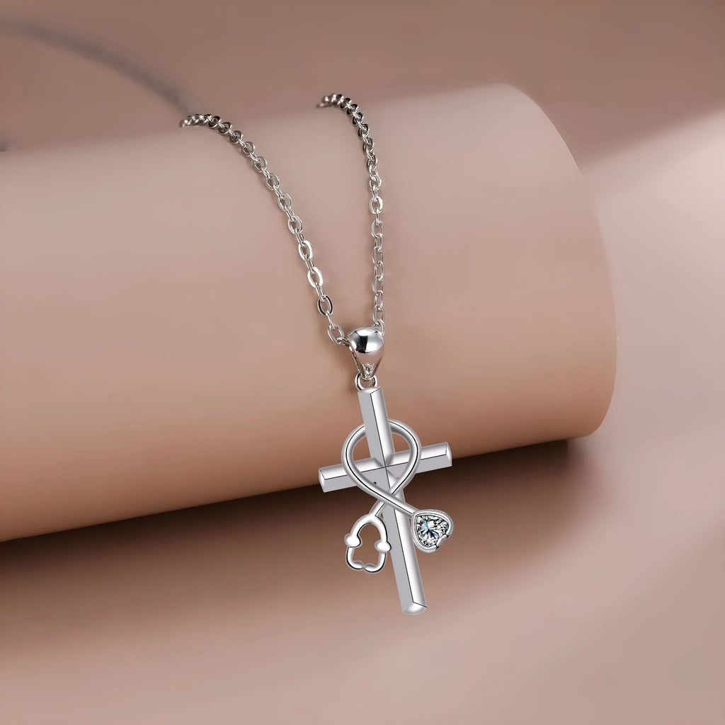 Women's copper cross stethoscope pendant necklace with electroplated finish on a cross chain.