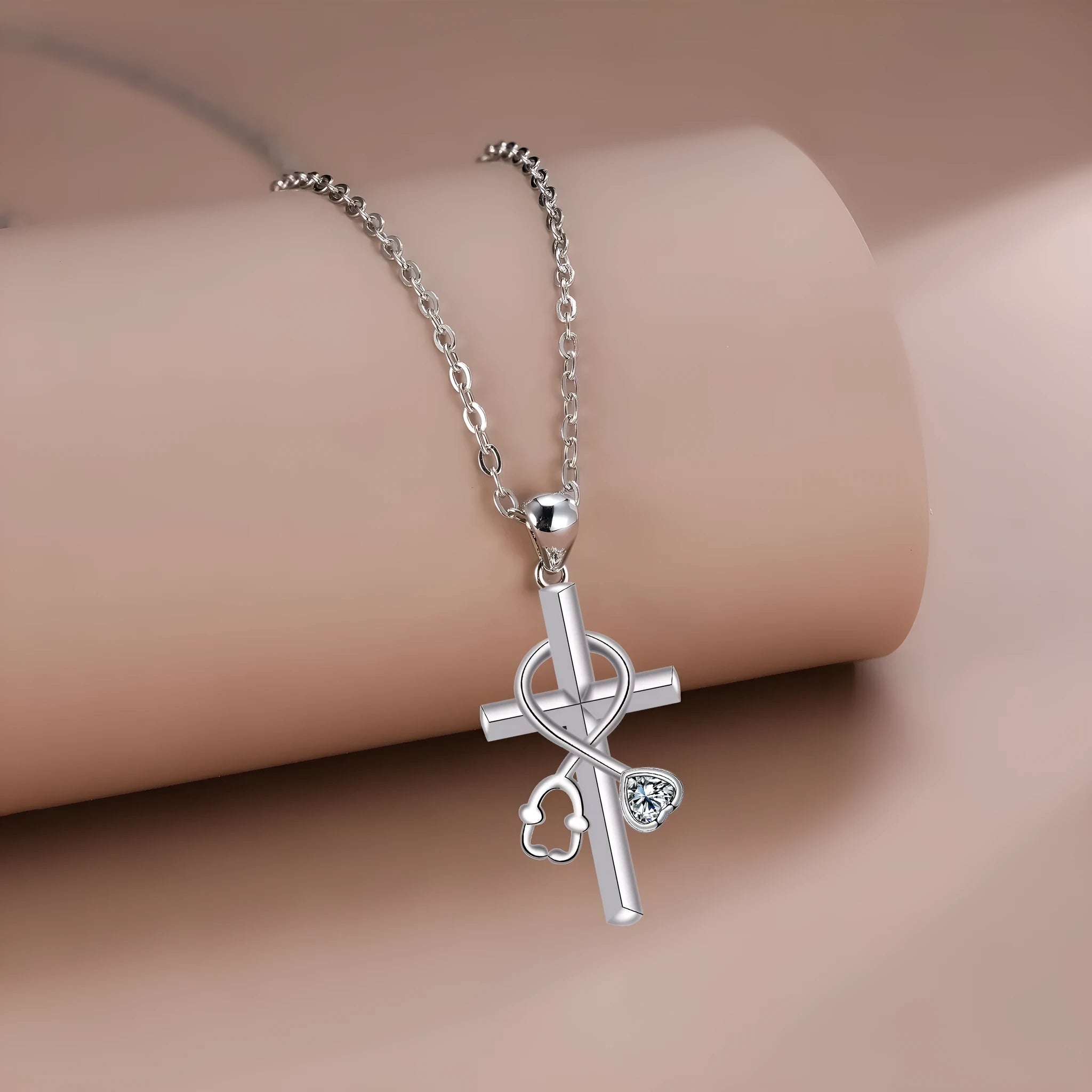 Women's copper cross stethoscope pendant necklace with electroplated finish on a cross chain.
