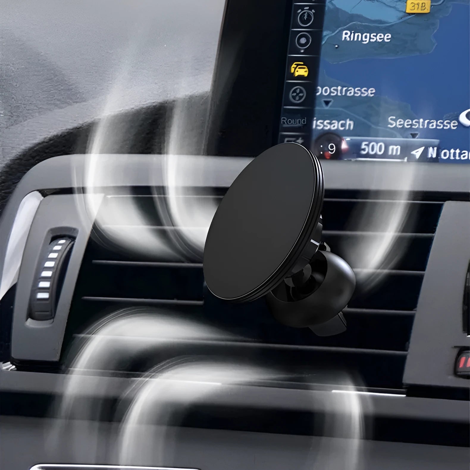Black aluminium alloy magnetic suction car phone holder mounted on a car air vent