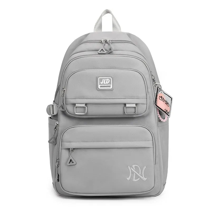 Girls' large capacity waterproof school backpack with physiological curve backplane in multiple colour and pattern options