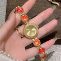 Women's quartz watch with 25mm round dial in one of six colours including milky white and dark green