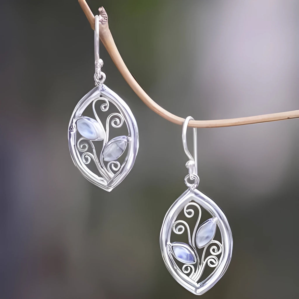 Silver leaf-shaped earrings with colourful moonstone stones embedded in alloy design