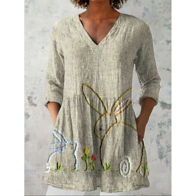 Women's printed loose wave dress with wide waist and three-quarter sleeves in a floral pattern.