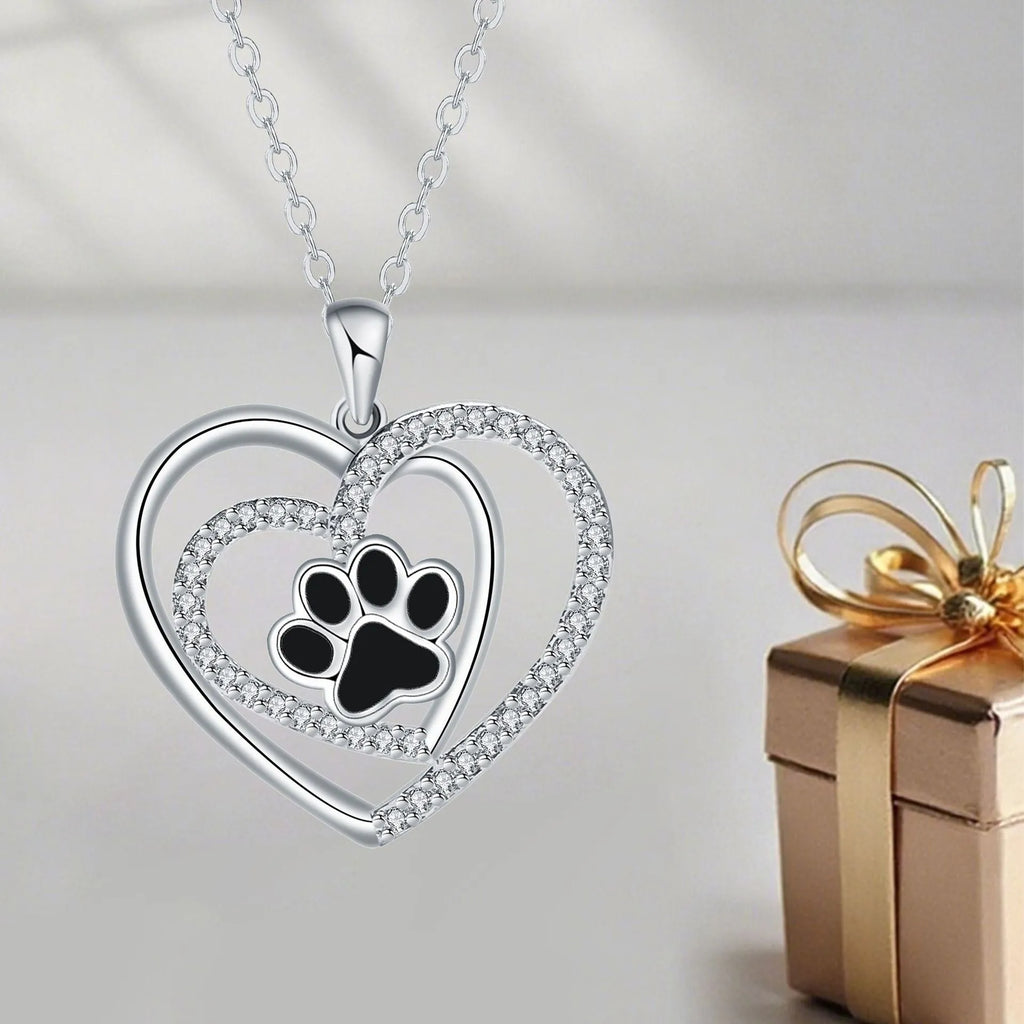 Women's dog paw print pendant necklace with electroplated copper finish on a cross chain.