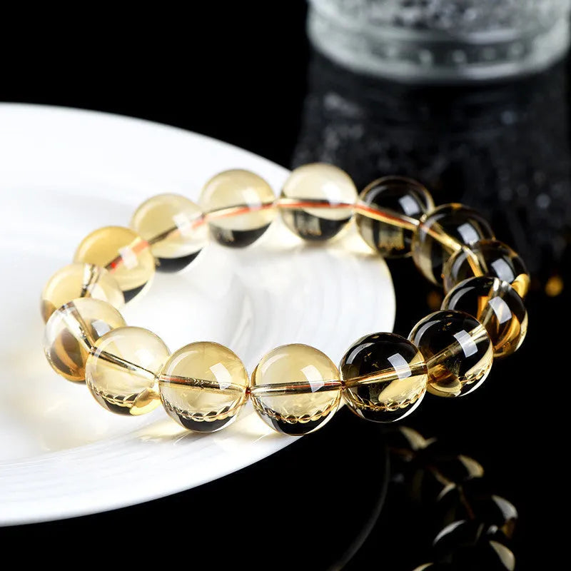 Natural citrine scattered beads ball bracelet showing polished yellow gemstone balls on a string, with colour grade and size options.