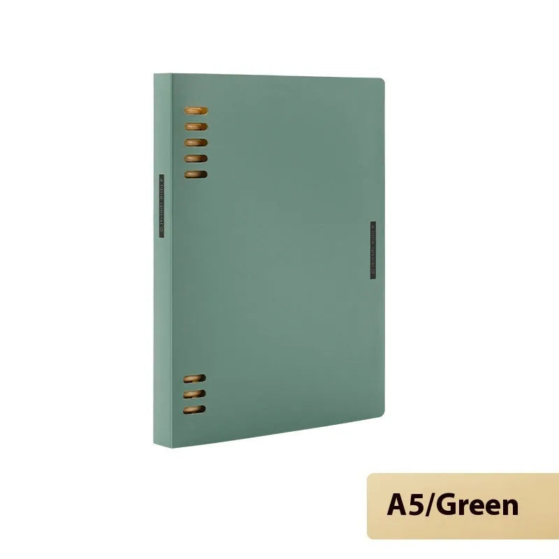 Refillable loose-leaf spiral notebook with PP cover open, showing raw wood pulp paper in grid ruling.