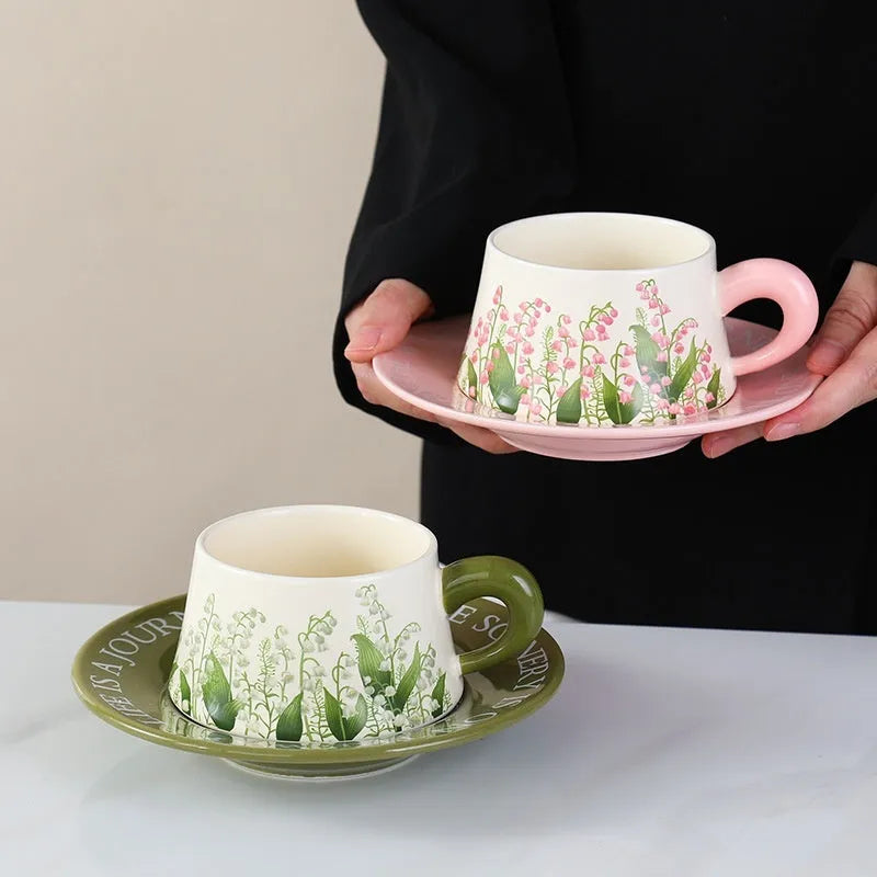 Ceramic coffee cup set with two 300ml cups, saucers and stirring spoons in decorative designs