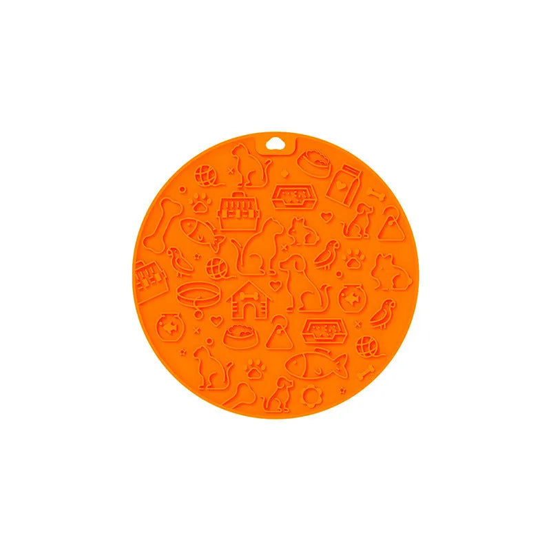 Round blue silicone pet lick mat with suction cup base on a kitchen counter