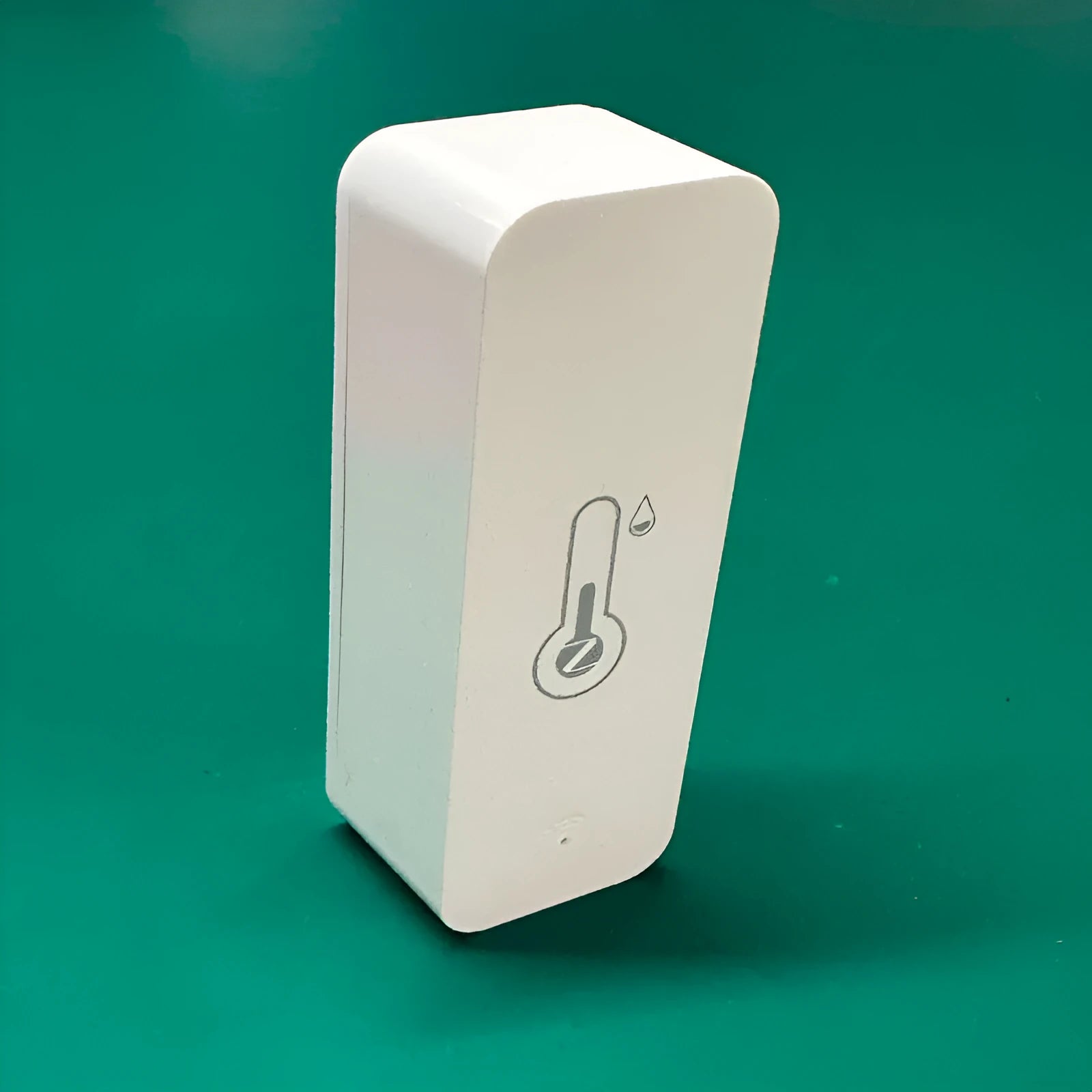 Compact white ABS plastic WiFi Zigbee temperature and humidity sensor for Tuya smart homes.