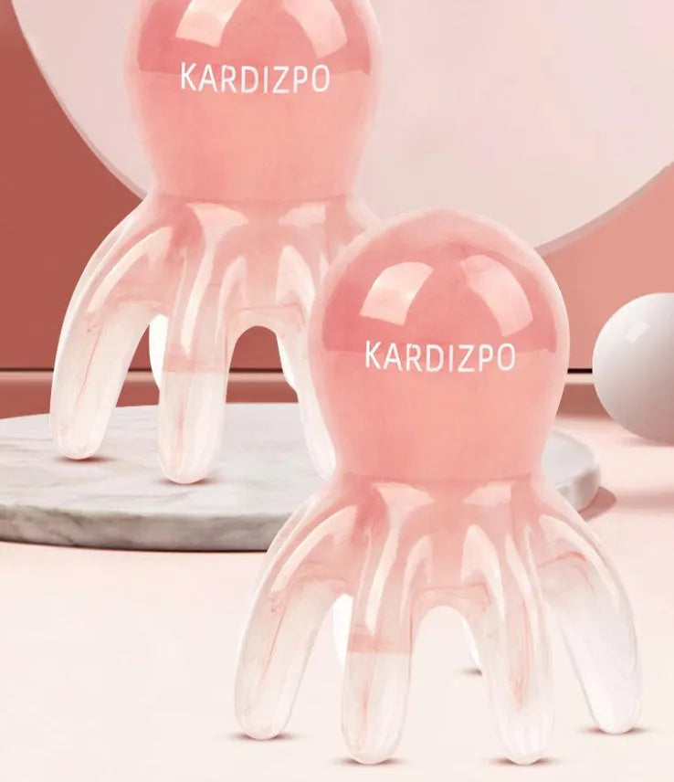 Small pink octopus-shaped natural resin massage comb with storage bag.