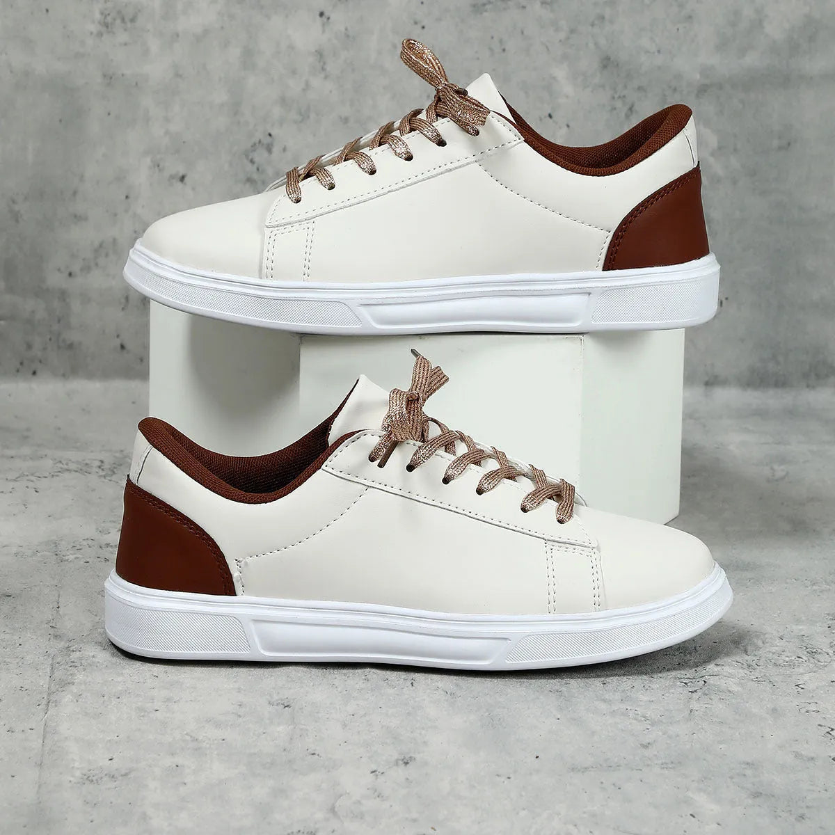Platform skateboard sneakers in beige brown with cross strap and rubber sole