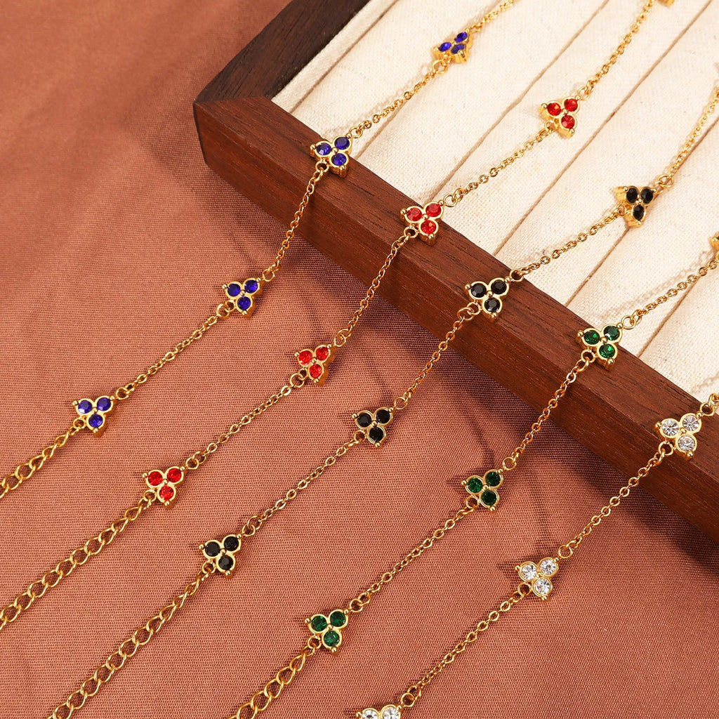 Geometric triangle women's bracelet in stainless steel with a choice of coloured centre stones on a gold or steel band.