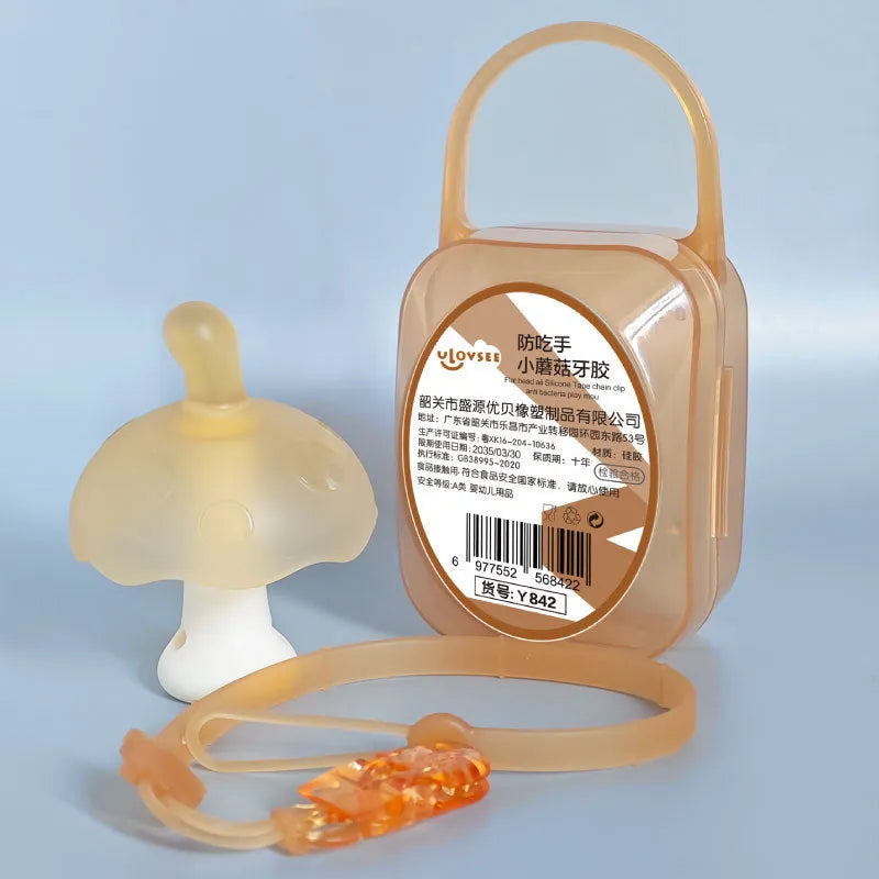 Small mushroom-shaped silicone chew gum with transparent chain attachment in pink colour