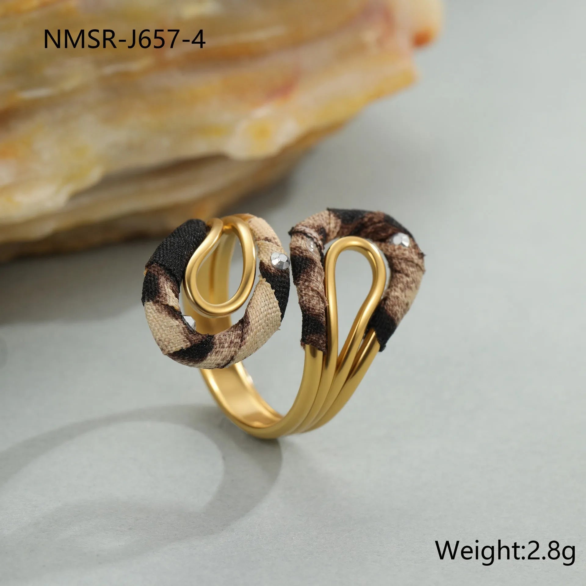 Leopard print geometric open mouth adjustable ring in stainless steel, showing heart shape on finger.