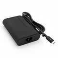 Black oval 65W USB-C laptop power adapter with Type-C port and multiple international power cords