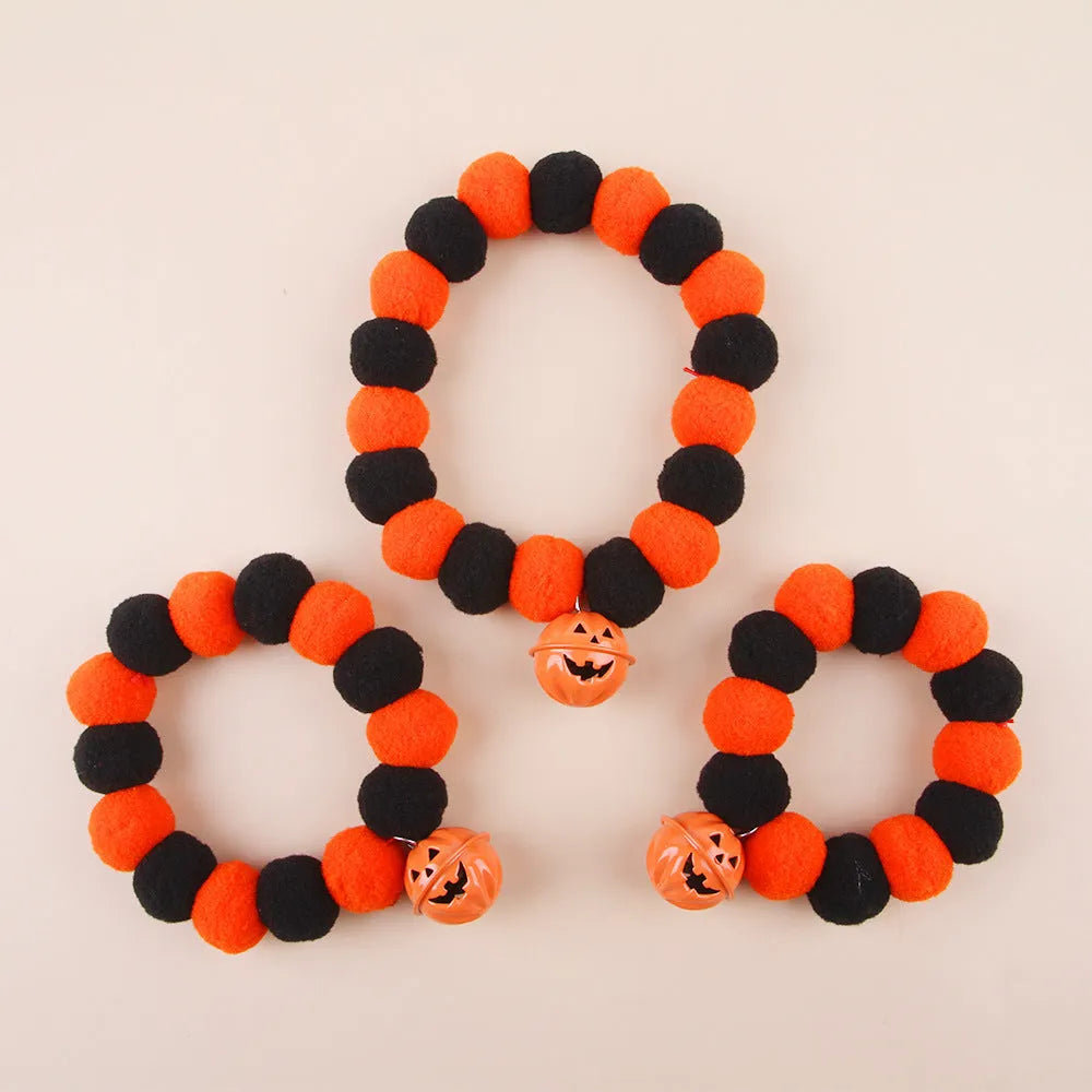 Orange Halloween pumpkin motif cat collar with an adjustable buckle fastener.