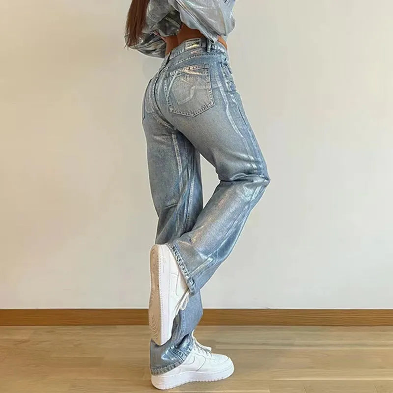 Blue high waist straight leg women's jeans with silver contrast stitching on denim fabric