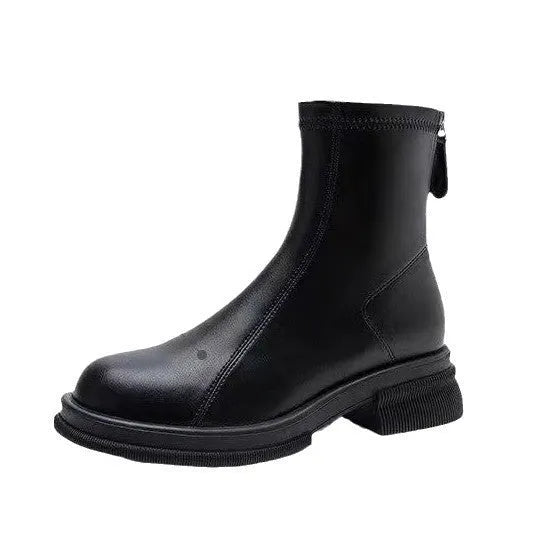 Women's black flat-heel ankle boot with back zipper and round toe on a neutral background.