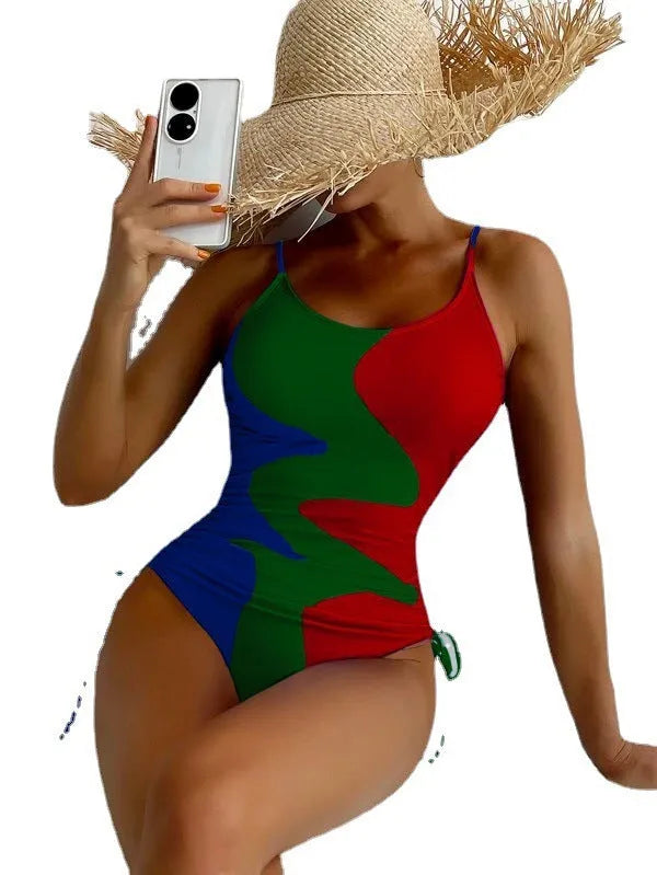 Women's sleeveless one-piece swimsuit in a striped print, showing backless design and available in multiple colours.