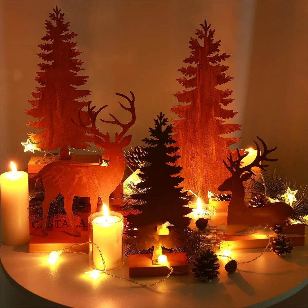 Three metal Christmas tree elk decorations with rusty patina finish displayed together