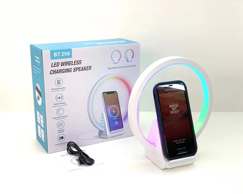 White rectangular Bluetooth speaker with wireless charging pad and ambient lighting