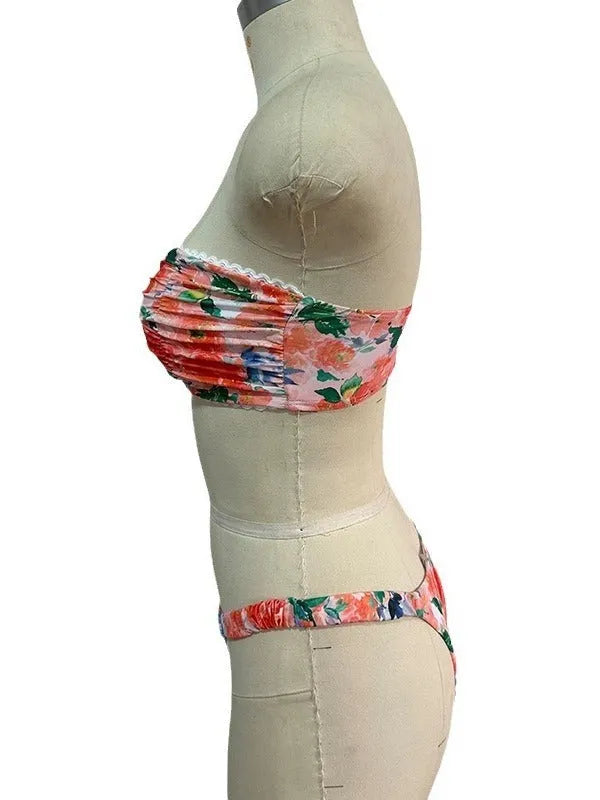 Women's tube top bikini set with lace trim in blue, yellow, pink, and floral print colours.