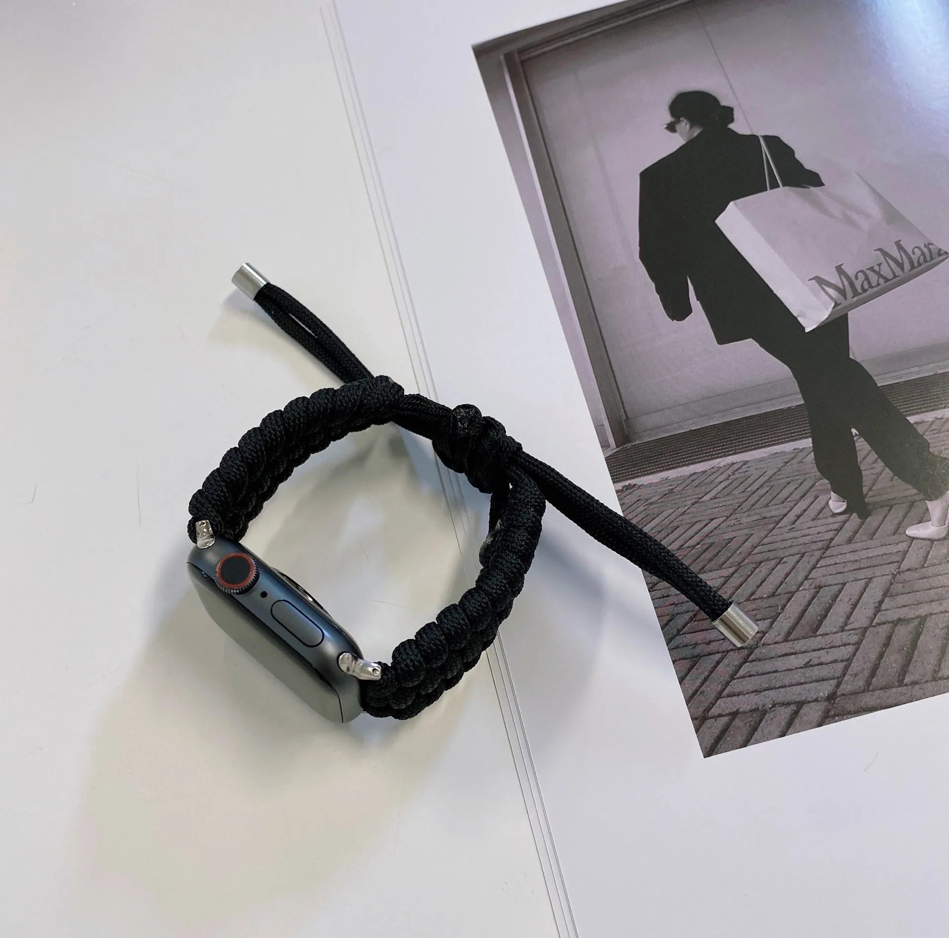 Paracord braided smart watch strap in black colour showing braided texture and standard watch attachment