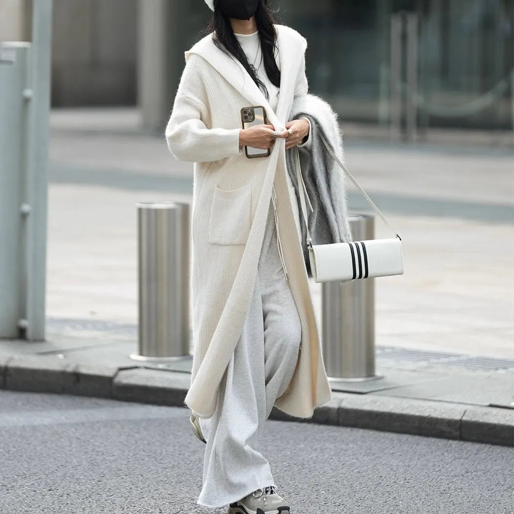 Long grey knitted cardigan hooded trench coat with splicing detail on mannequin