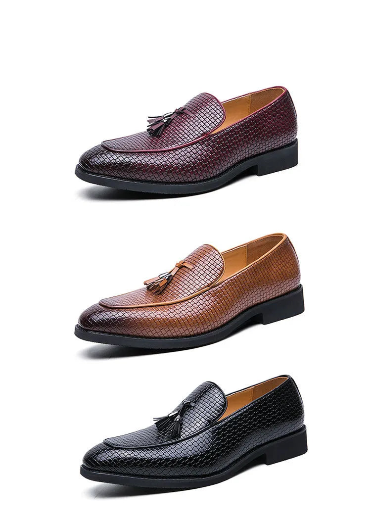 Men's black pointed toe slip on shoes with a gold tassel detail on the upper.
