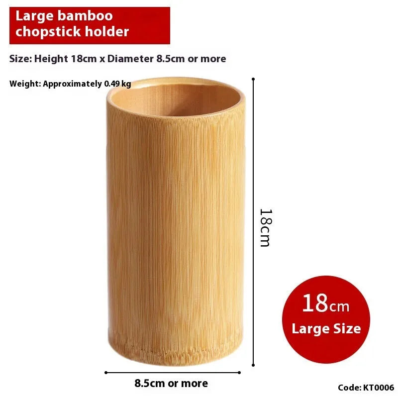 Wild bamboo chopsticks holder tube on a kitchen countertop.
