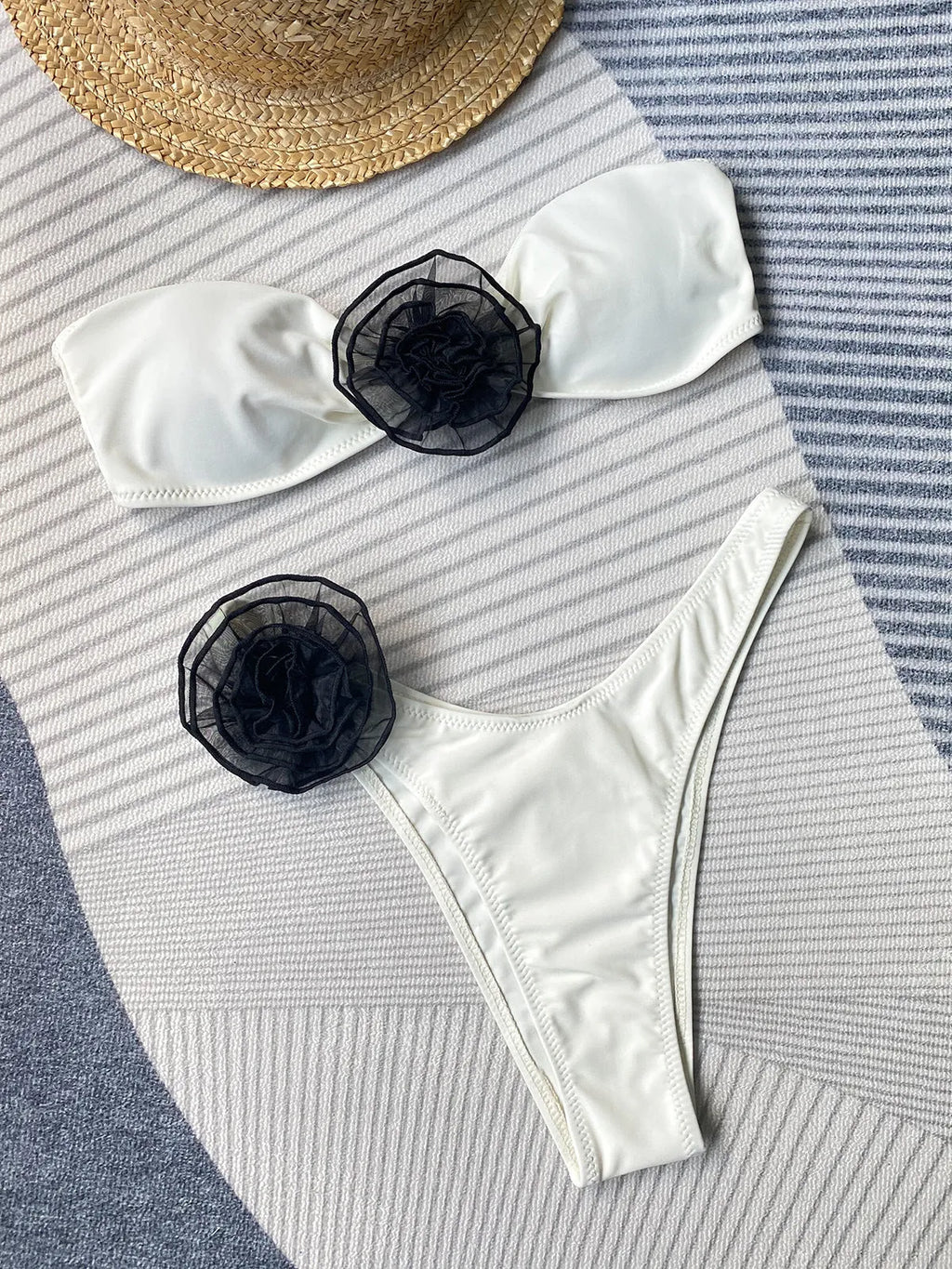 Striped bikini swimsuit set with a tube top, shorts, and a three-dimensional flower split design.