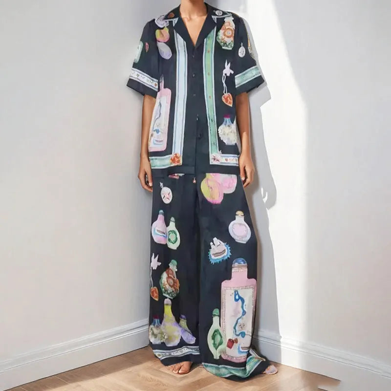 Black women's casual two-piece set with cartoon pattern cardigan and plain trousers