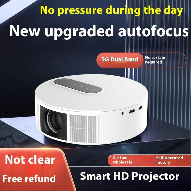 White 720p HD home projector with remote control on a table.