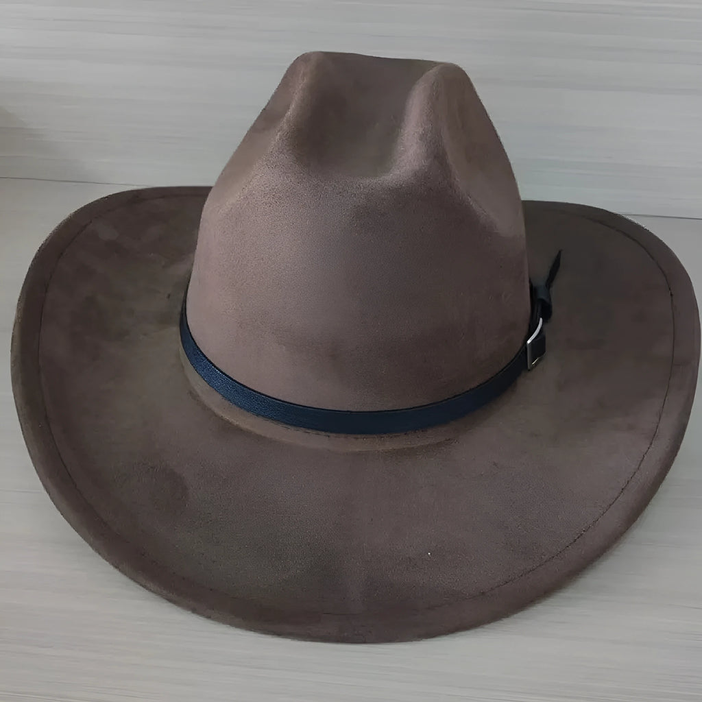 Brown leather velvet cowboy hat with curved brim and conical crown on neutral background