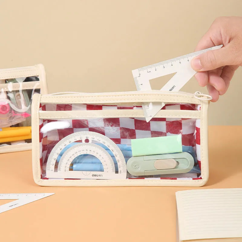 Transparent PVC pencil case with chessboard pattern showing pens inside, black and white grid design