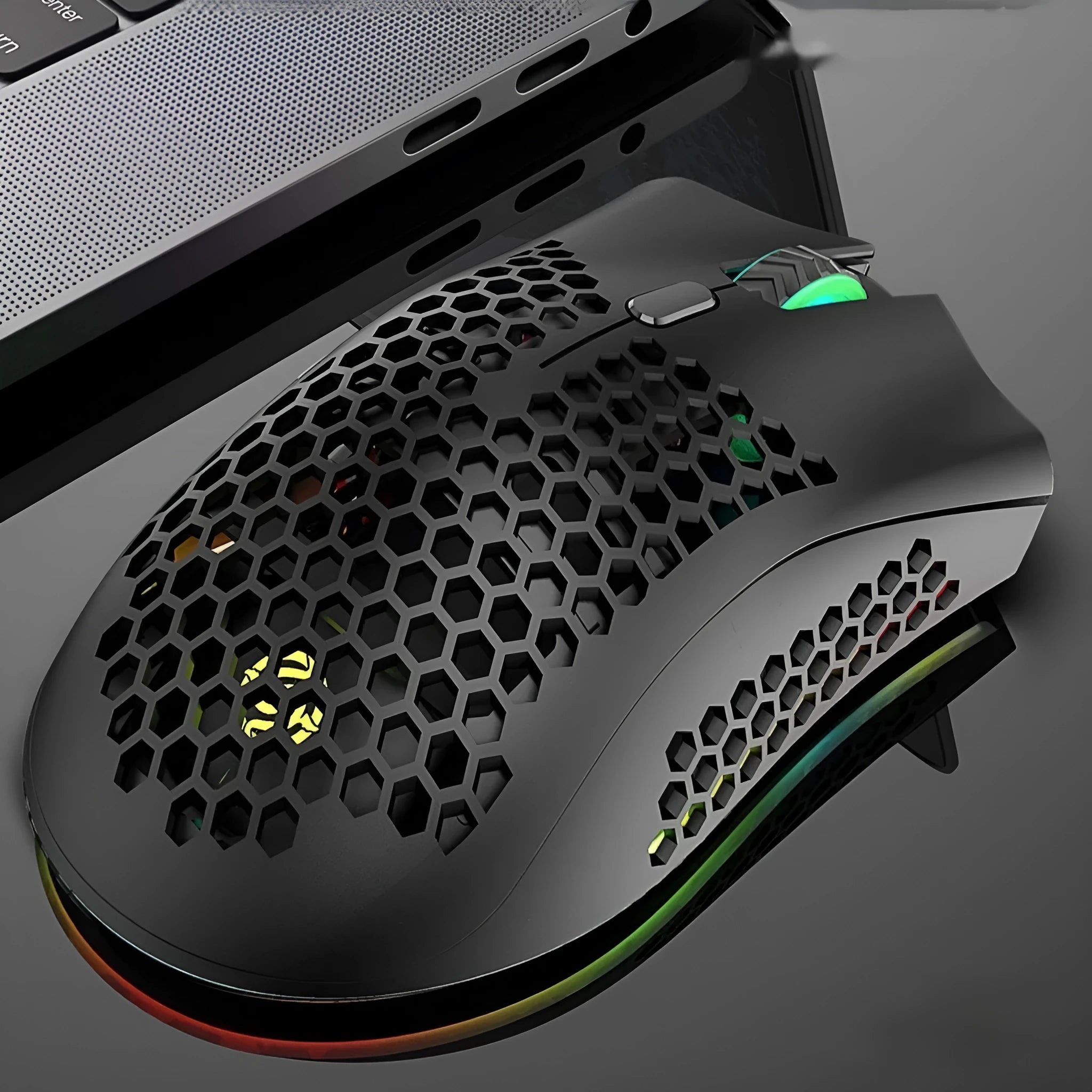 Wireless gaming mouse with hollow-out shell showing RGB lighting through openings