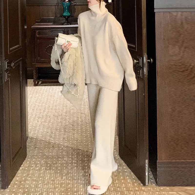 Women's casual two-piece set featuring a long sleeve sweater and wide leg trousers in a solid colour.