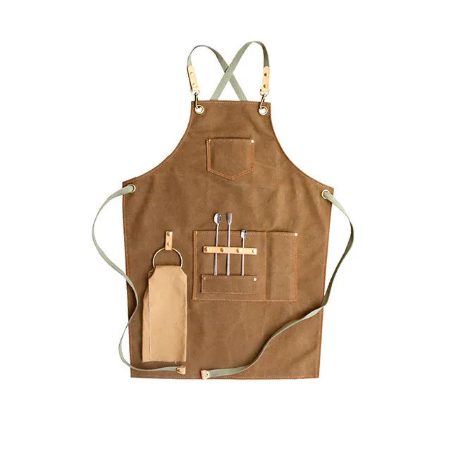 Canvas apron with cross back straps in camel colour for cafe and baking workwear
