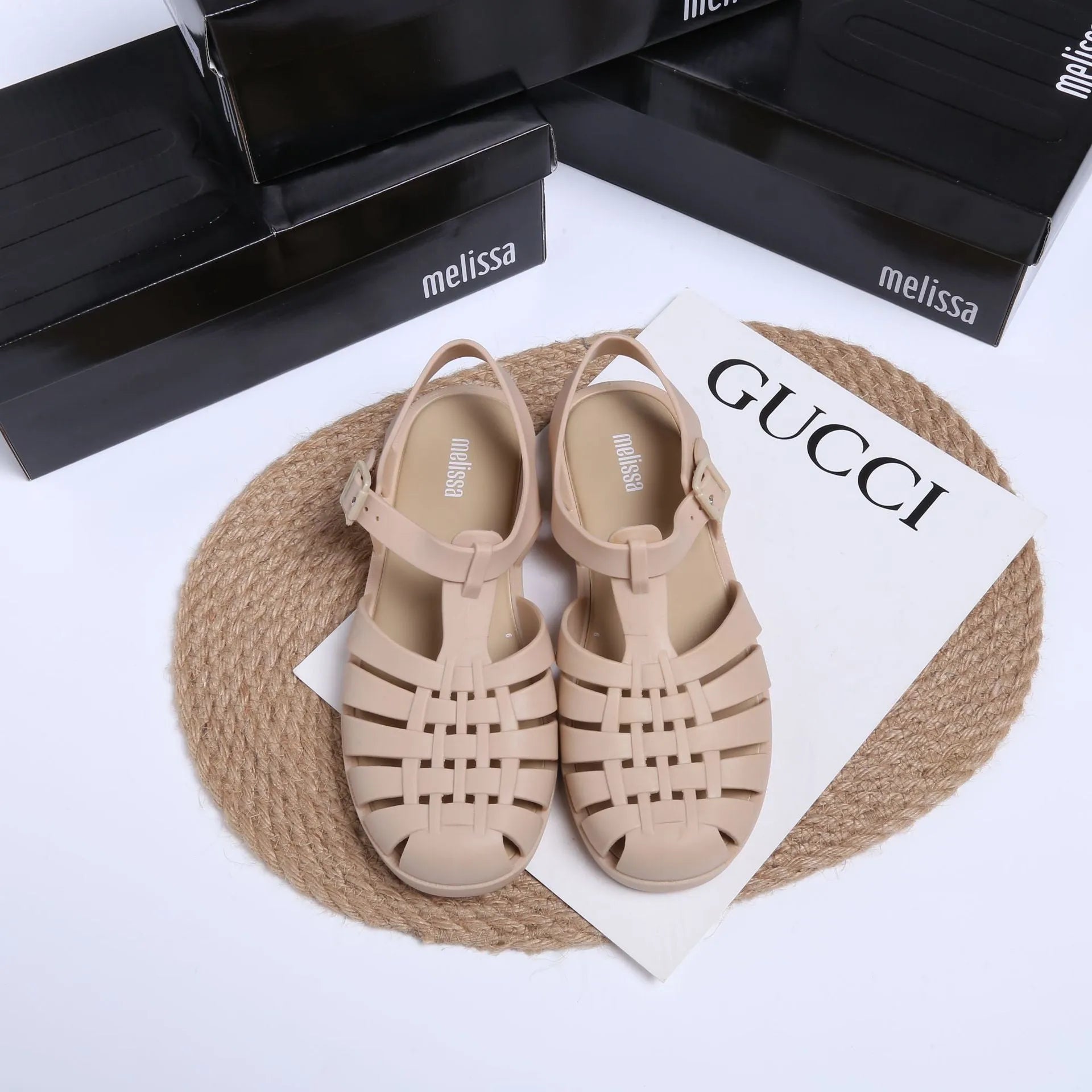 Vintage weave Roman sandals in matte black with buckle closure and round toe