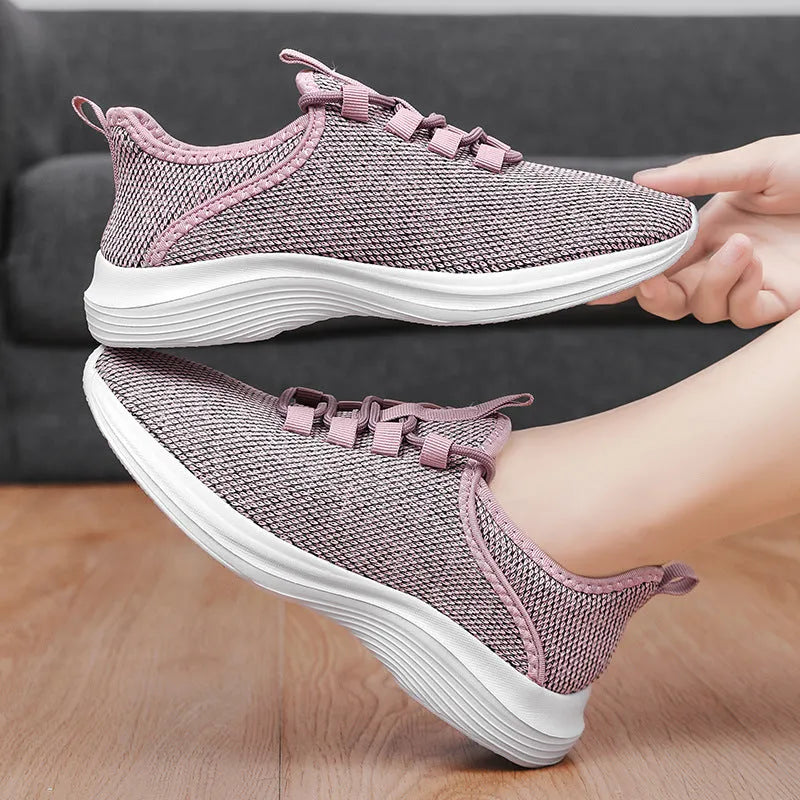 Women's low-top casual sneakers in mesh with lace-up front and EVA sole, shown in black colour.