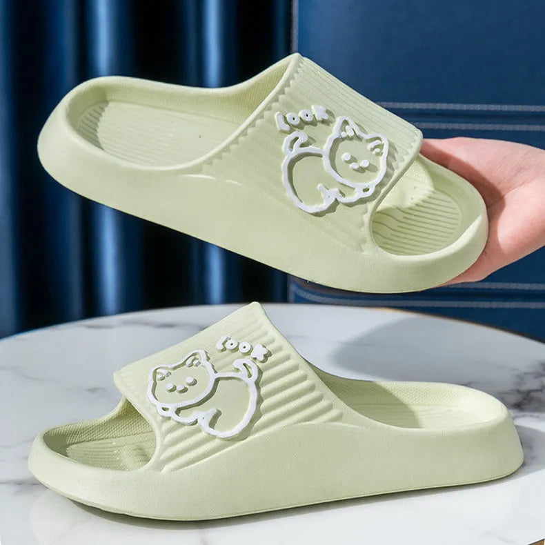 Green EVA cat flip-flop slippers with a thick platform sole on a white background.
