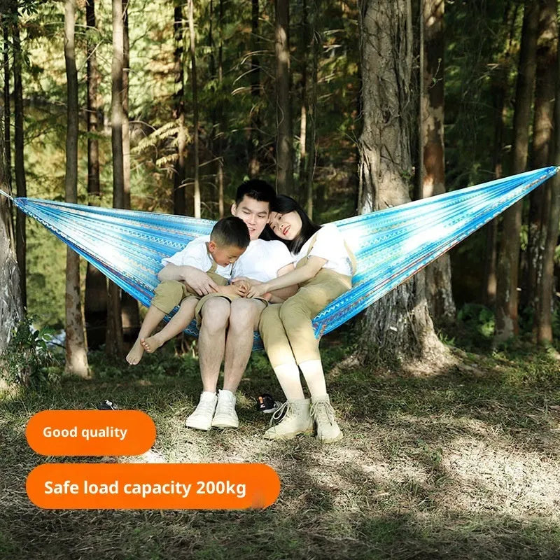 Outdoor parachute cloth hammock in bohemian yellow print, laid flat on grass, 260x140cm size